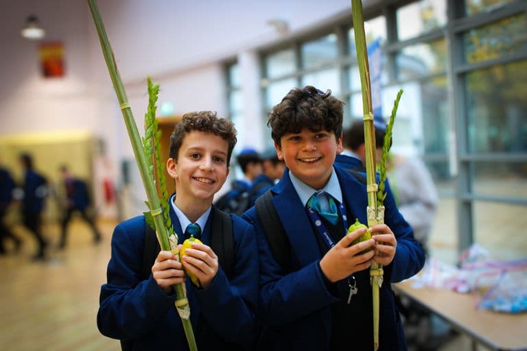 JFS students holding lulav and etrog for Sukkot