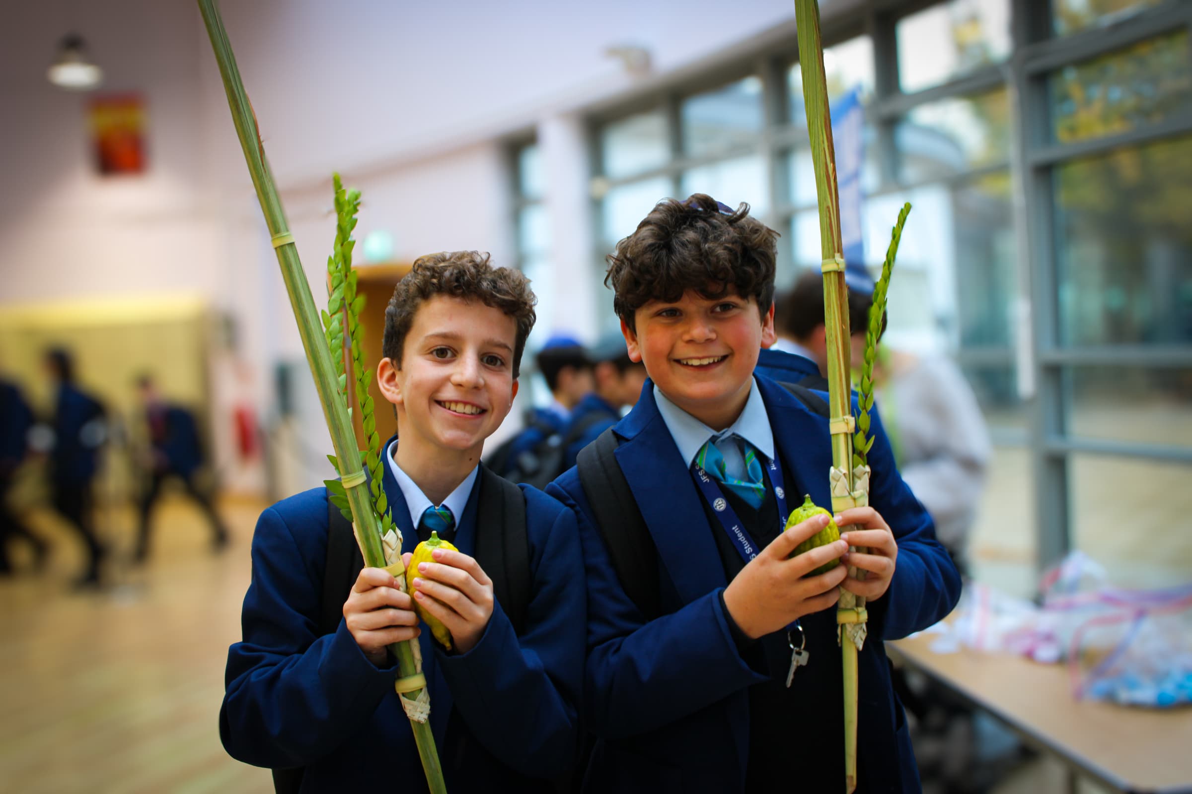 JFS students holding lulav and etrog for Sukkot