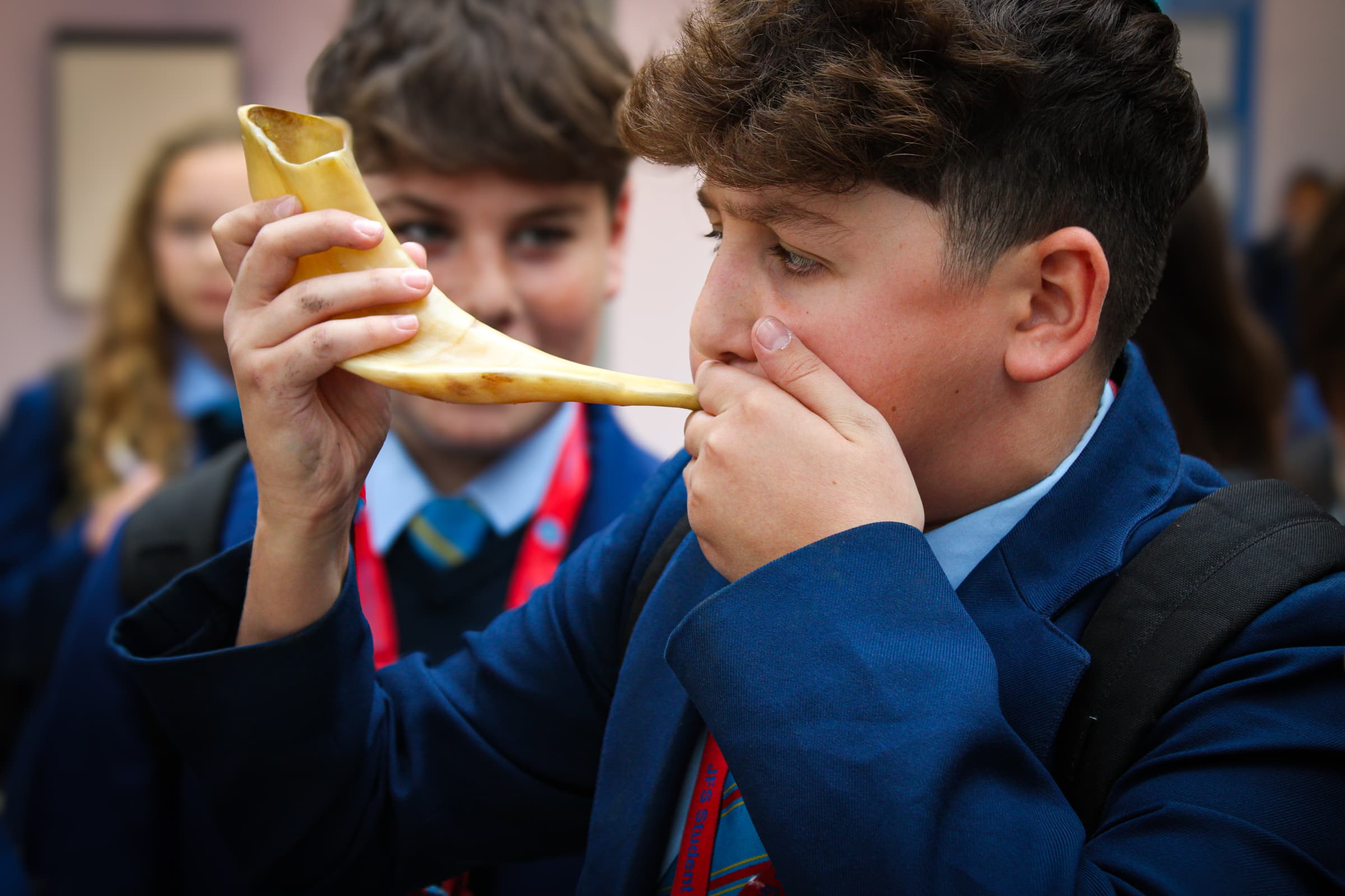 Rosh Hashanah - student blowing Shofar